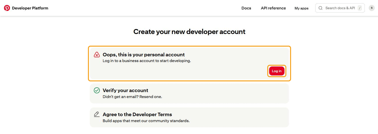 Halaman "Create your new developer account" di Developer Platform Pinterest: kotak "Oops, this is your personal account — Log in to a business account to start developing." beserta tombol merah Log in disorot. Di bawahnya langkah "Verify your account" (bercentang hijau) dan "Agree to the Developer Terms".