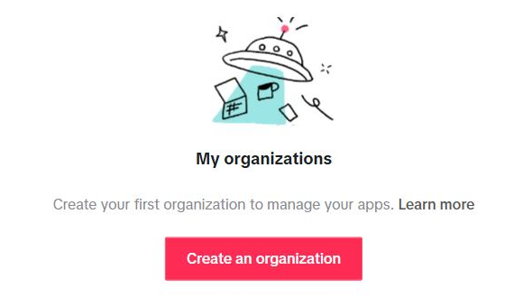 Halaman "My organizations" yang masih kosong: kalimat "Create your first organization to manage your apps. Learn more" dan tombol merah "Create an organization".