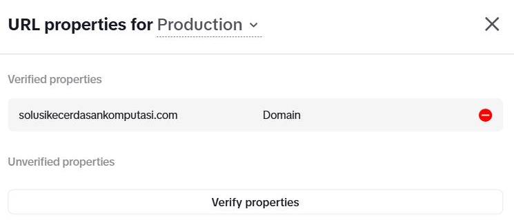 Jendela "URL properties for Production": bagian "Verified properties" berisi baris "solusikecerdasankomputasi.com — Domain" dengan tombol hapus merah, bagian "Unverified properties" kosong, dan tombol "Verify properties".